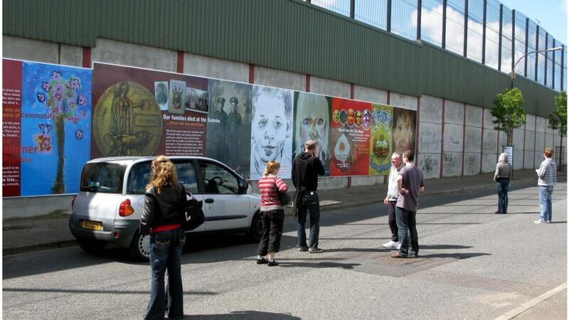 Tourists at the  wall on Cupar Street, off Shankill Road. Photograph: David Sleator