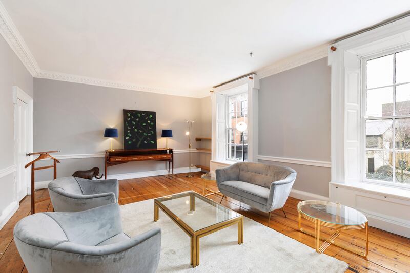 Extending to 121sq m (1,302sq ft) over two floors, the apartment retains  period details such as open fireplaces, high ceilings, detailed cornicing and polished pine floors.