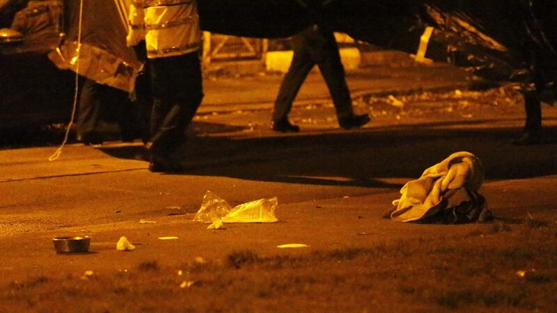 Items are seen on the ground near where David Douglas was shot and wounded on Killala Road, in Dublin 7 on Sunday evening.  Photograph: Collins