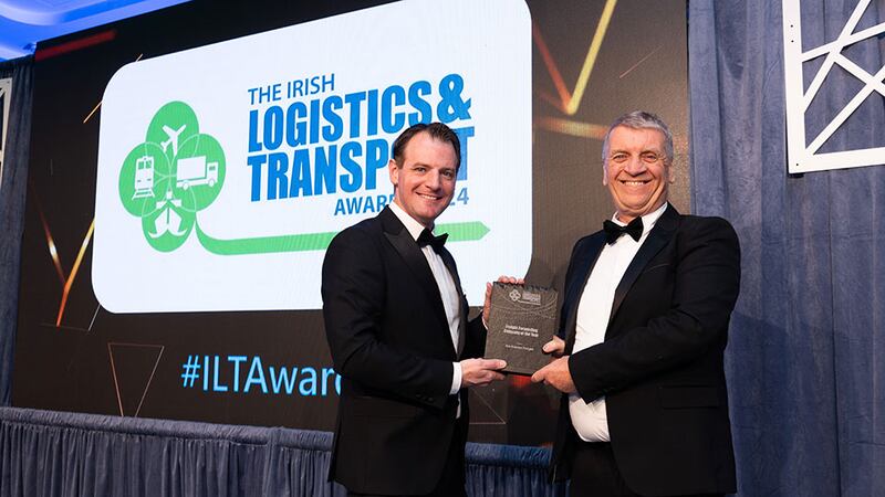 Seamus Kavanagh, executive officer, Irish International Freight Association presents the freight forwarding company of the year award to Philip Tracey, Ace Express Freight