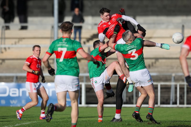 Munster GAA Senior Football Club Championship Semi-Final, Cusack Park, Ennis 24/11/2024
Loughmore-Castleiney vs Eire Og
Gavin Cooney scores the Eire Ogs second goal against Tomas McGrath and Willie Eviston of Loughmore-Castleiney
Mandatory Credit ©INPHO/Natasha Barton