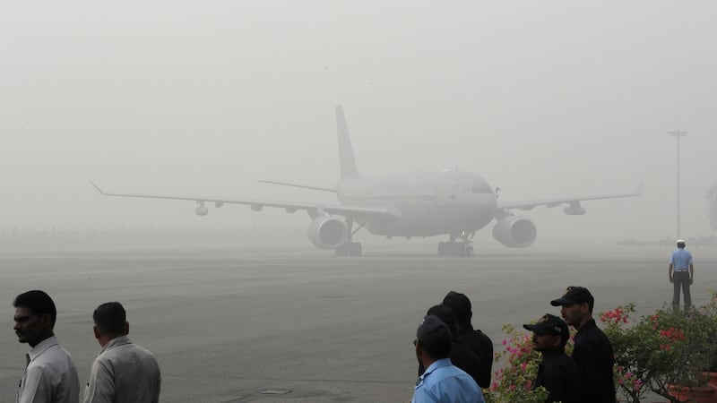 A Royal Air Force aircraft carrying UK Prince Charles and his wife Camilla, Duchess of Cornwall, arrives enveloped in smog in New Delhi, India on Wednesday. Photograph: Manish Swarup/PA