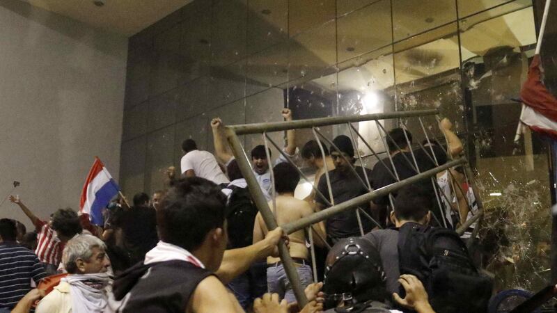 Protesters storm the National Congress in Asuncion, Paraguay on Friday. Photograph: EPA