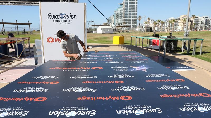 A worker builds a stage as part of the Eurovision Village complex for shows and parties near the beach in Tel Aviv, Israel. Photograph: EPA/Abir Sultan