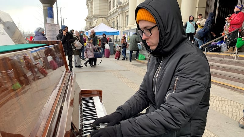 Pianist Oleksiy ‘Alex’ Karpenko says playing the piano for refugees at Lviv train station is his way of fighting in the war. Photograph: Lara Marlowe