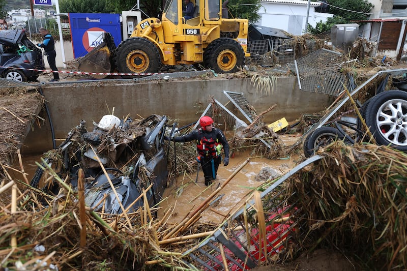 Rescue teams continued to search the island on Sunday. Photograph: AFP via Getty Images