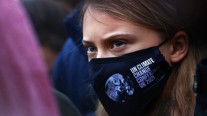 TOPSHOT - Swedish climate activist Greta Thunberg takes part in a protest at Festival Park in Glasgow on the sidelines of the COP26 UN Climate Summit on November 1, 2021. - More than 120 world leaders meet in Glasgow in a "last, best hope" to tackle the climate crisis and avert a looming global disaster. (Photo by Adrian DENNIS / AFP) (Photo by ADRIAN DENNIS/AFP via Getty Images) *** BESTPIX ***