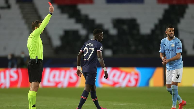 Idrissa Gueye of Paris Saint-Germain is shown a red card by referee Felix Brych for a foul on Manchester City’s Ilkay Gündogan during the  Champions League semi-final,  first leg at the Parc Des Princes. Photograph:  Alex Grimm/Getty Images