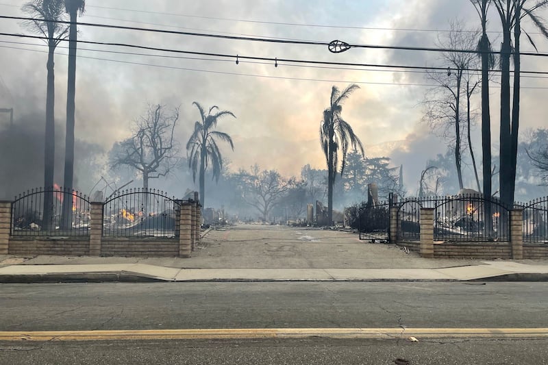 Homes have been destroyed in the fires, which firefighters are battling to control. Photograph: EJ Soto/AP