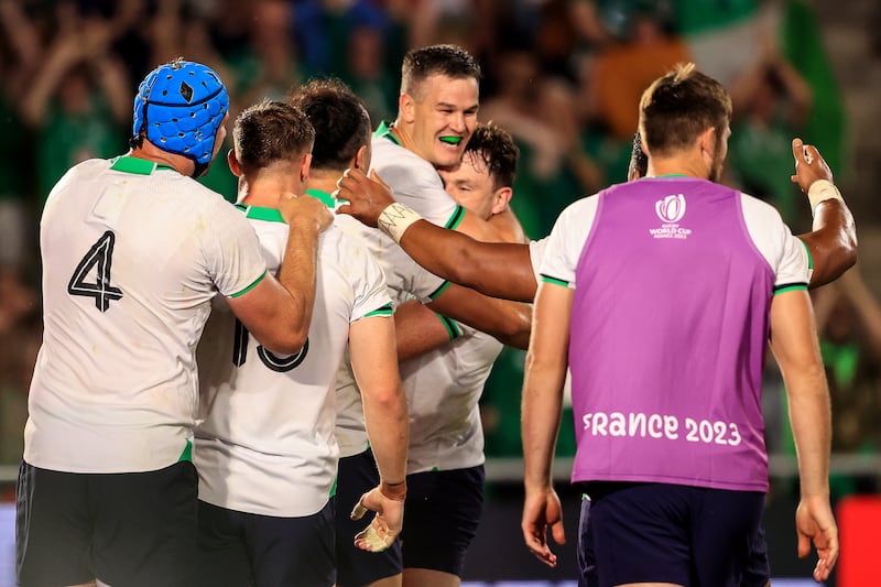 Johnny Sexton is mobbed by teammates after claiming the records. Photograph: Dan Sheridan/Inpho