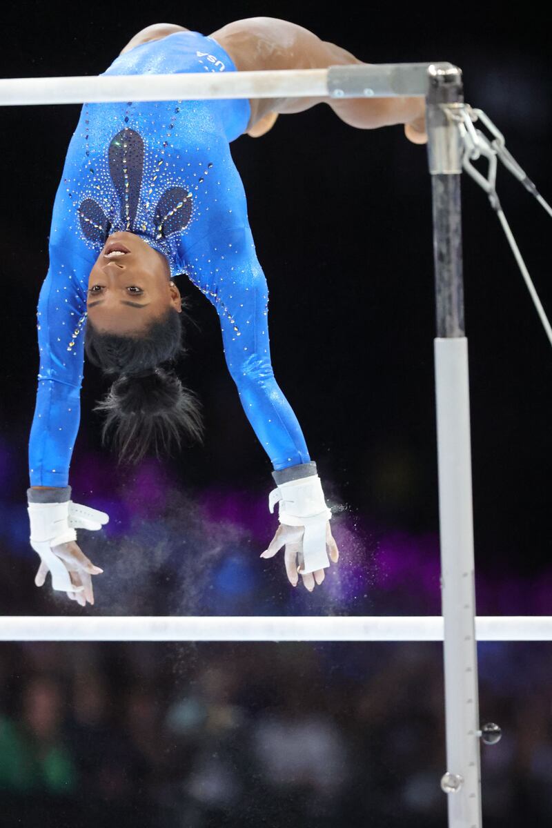 Simone Biles performs on the uneven bars at the event. Photograph: Olivier Matthys/EPA