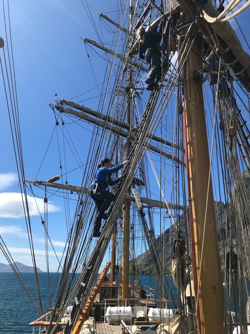 Collette Furey climbing one of the masts of the ship.