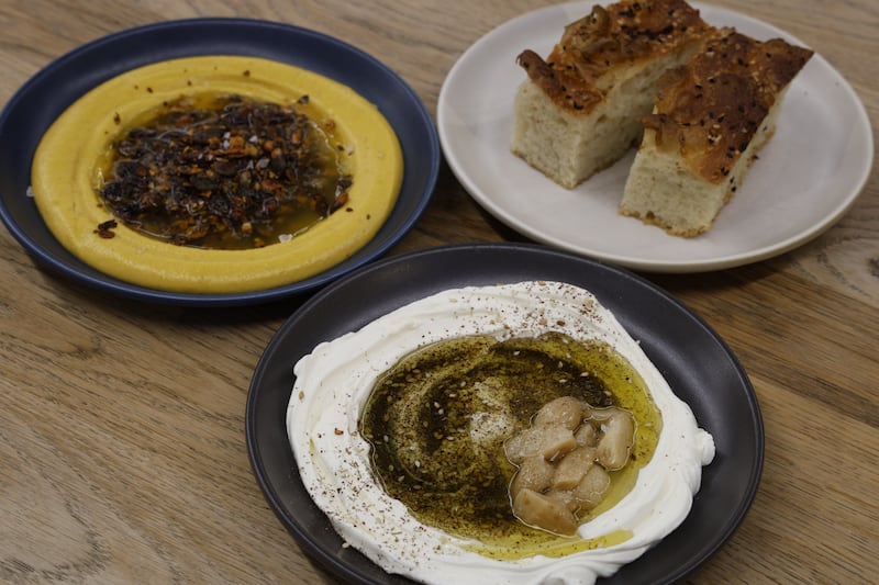 Tang: Labneh, confit garlic, za’atar; Kuri pumpkin, brown butter, maple dukkah dip; sesame seed focaccia. Photograph: Nick Bradshaw