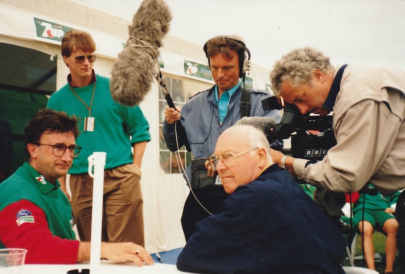 Eddie Jordan, left, prepares to be interviewed by BBC commentator Murray Walker, seated, in July 1991