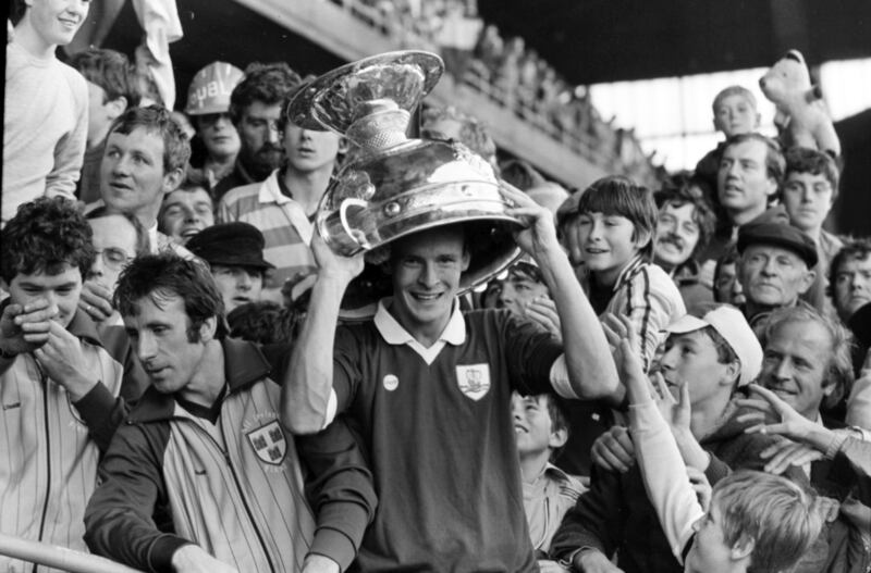 Barney Rock, Dublin's leading scorer in the championship, celebrates after the 1983 All-Ireland final, wearing a Galway shirt - and the Sam Maguire trophy as headgear. Photograph: Tom Lawlor