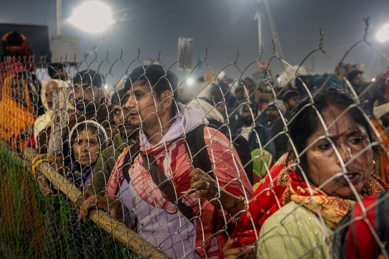 Devotees look on  after a stampede at the Kumbh Mela  religious festival  in Allahabad, India. . Photograph: Elke Scholiers/Getty Images