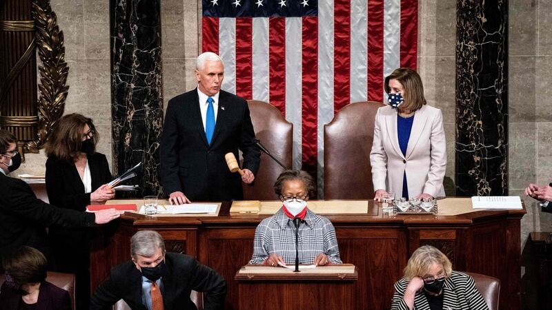 US vice president Mike Pence and House of Representatives speaker Nancy Pelosi preside over a Joint session of Congress to certify the 2020 Electoral College results after supporters of  Donald Trump stormed the Capitol earlier in the day. Photograph: Erin Schaff/POOL/AFP via Getty Images.