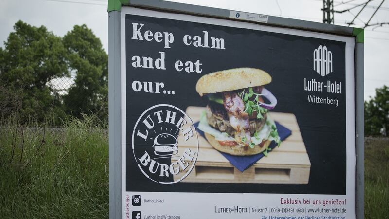 A billboard advertising  “Luther burgers” in Wittenberg. Photograph: Axel Schmidt/Getty Images