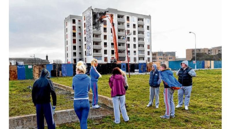 Local youths watch the demolition. photograph: dara mac dónaill