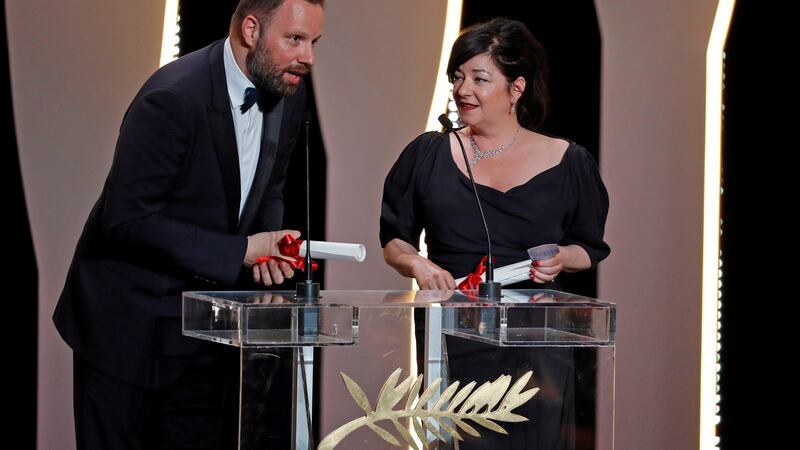 Director Yorgos Lanthimos, who was awarded best screenplay for his film “The Killing of a Sacred Deer”, delivers a speech next to director Lynne Ramsay. Photograph: Eric Gaillard/Reuters