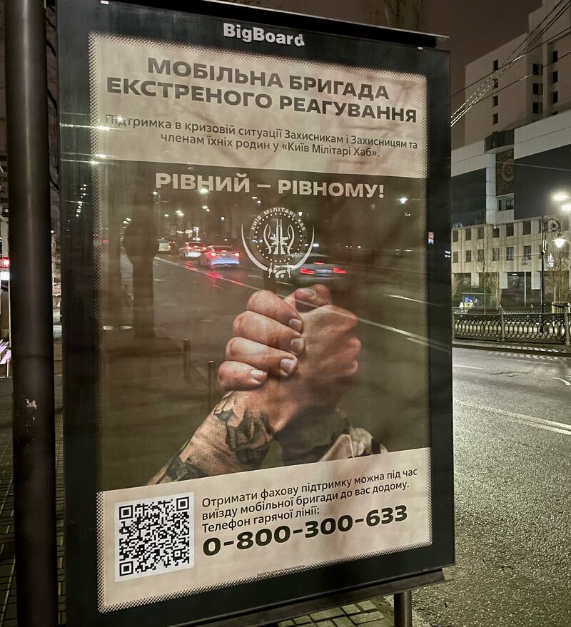 A poster in central Kyiv offering peer-to-peer support for soldiers suffering mental health problems. Photograph: Daniel McLaughlin