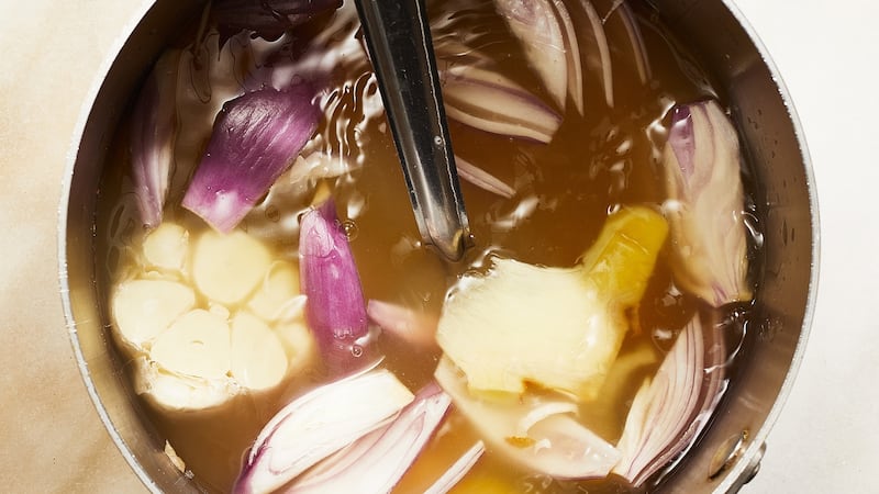 Chicken stock is infused with ginger, shallot and garlic for the broth.