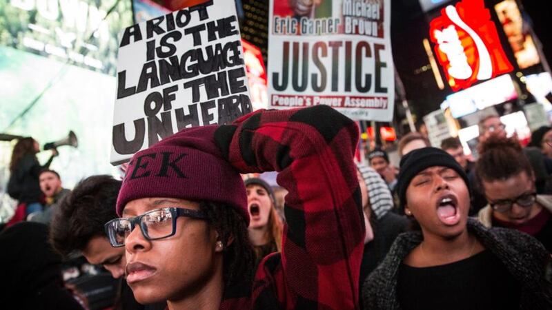 People protest in Times Square over the Ferguson grand jury decision to not indict officer Darren Wilson in the Michael Brown case. Photograph: Andrew Burton/Getty Images.