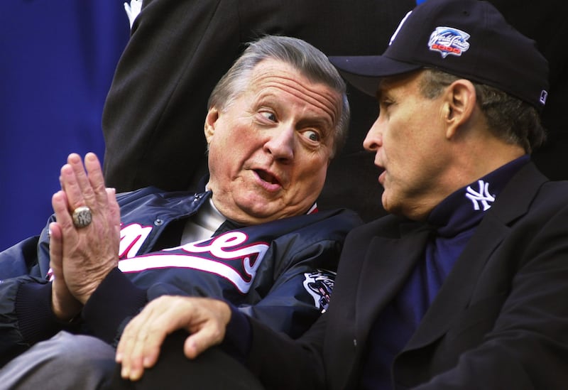 Then New York City mayor Rudy Giuliani (right) talks to New York Yankees then owner George Steinbrenner in 2000. Photo by Chris Hondros/Getty Images