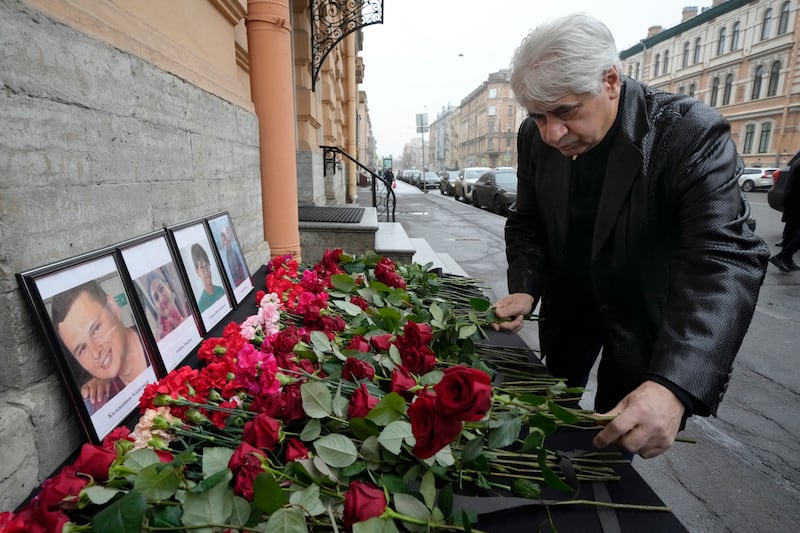 The head of the Azerbaijani diaspora in St Petersburg, Vagif Mamishev, lays flowers at the consulate of Azerbaijan in the city. Photograph: Dmitri Lovetsky/AP