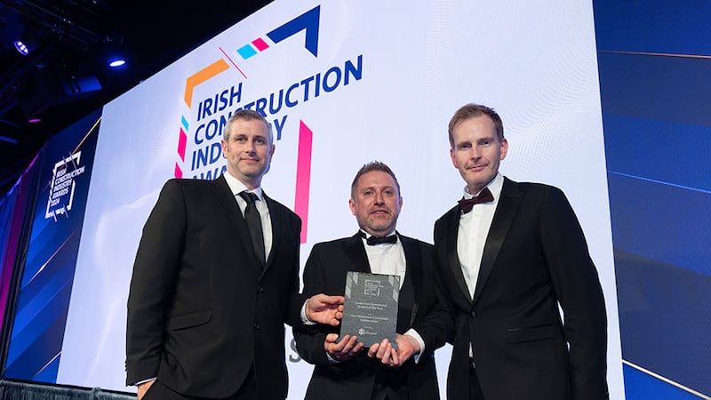 Ken Peacham, sales manager at Boon Edam Ireland Ltd, presents the contractor commercial project of the year award to Keith Oliver and Alan Farrell, Flynn Management & Contractors