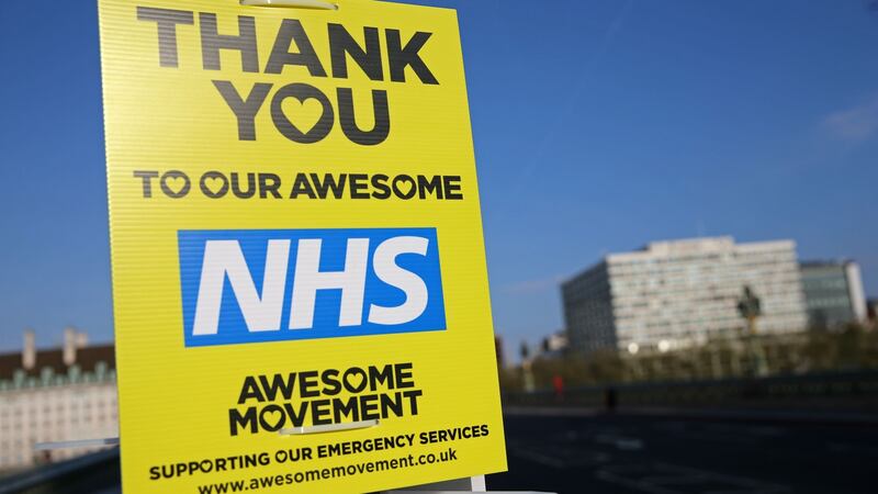 A sign thanking National Health Service workers is seen on lamppost on Westminster Bridge in London. The coronavirus death rate in the UK is around double that in Ireland. Photograph: Isabel Infantes/AFP via Getty Images.