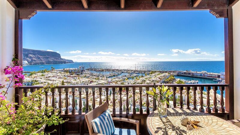 This apartment overlooks the harbour in Mogan, and  has a roof terrace with an outdoor kitchen for dining al fresco.