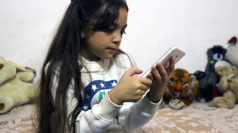 Bana al-Abed, who with the help of her mother has been posting tweets in English on life in the besieged eastern districts of Aleppo, Syria. Photograph: Thaer Mohammed/AFP/Getty Images