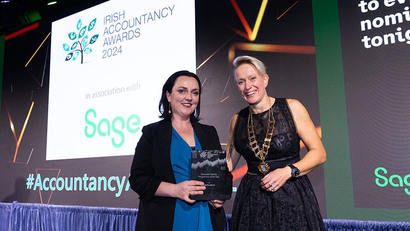 Sinead Donovan, president, Chartered Accountant Ireland, presents the graduate training programme of the year award to Caitriona Fitzsimons, Deloitte Ireland