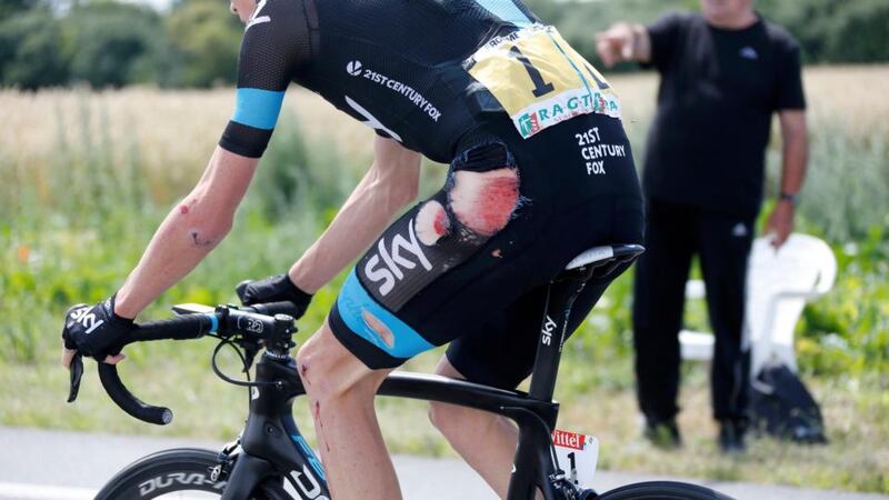 Team Sky rider Christopher Froome cycles among the peloton after crashing during the fourth stage of the Tour de France from Le Touquet-Paris-Plage to Lille. Jean-Paul Pelissier/Reuters