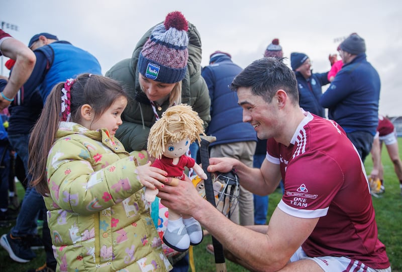 St Martin's Barry O'Connor with young supporter Fiadh Walsh and her mother Ciara after the quarter-final win over Naas. Photograph: Tom Maher/Inpho