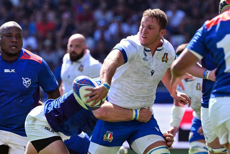 Michele Lamaro offloads during Italy's 57-8 win over Namibia at the Rugby World Cup in September. Photograph: Giuseppe Fama/Inpho 