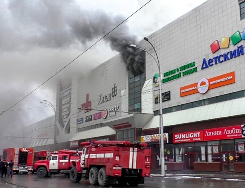 Emergency vehicles outside the burning shopping centre in Kemerovo. Photograph: AFP