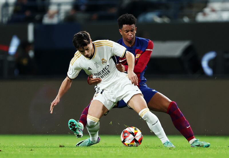 Brahim Diaz of Real Madrid battles for possession with Alejandro Balde of Barcelona. Photograph: Yasser Bakhsh/Getty Images