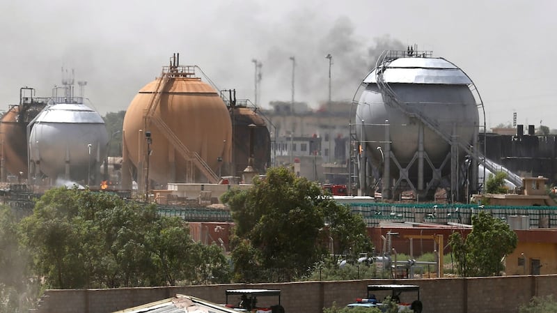 Smoke rises from gas storage tanks after a bomb attack against a state-run cooking gas factory in Taji at Baghdad’s northern outskirts on Sunday. Photograph: Reuters