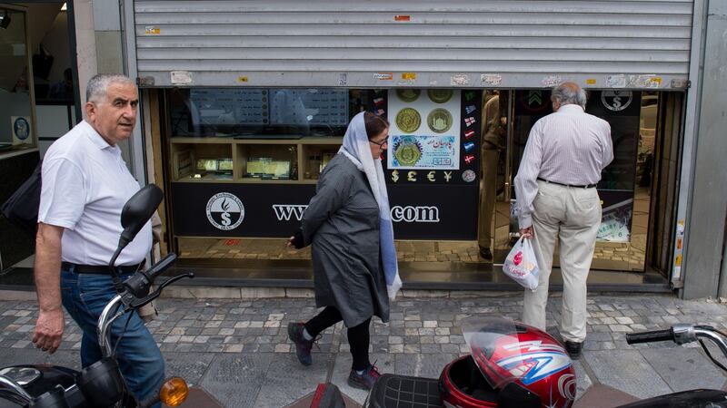 A shutter covers a closed currency exchange bureau displaying no currency rate prices in Tehran on Wednesday. Photograph:  Ali Mohammadi/Bloomberg