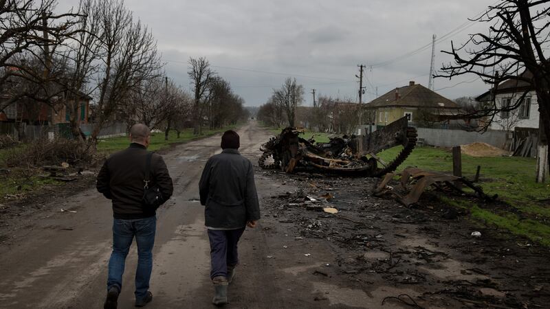 A destroyed Russian armoured vehicle in the agricultural village of Husarivka, Ukraine. Photograph: Tyler Hicks/The New York Times