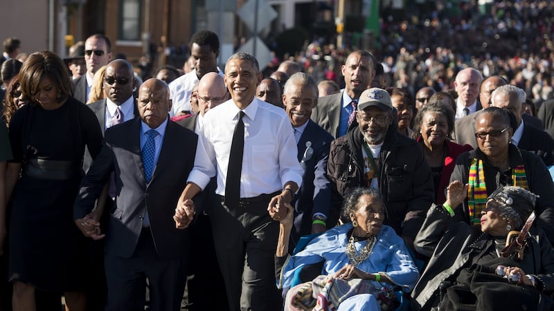 US president Barack Obama walks alongside Amelia Boynton Robinson (second right), one of the original marchers; first lady Michelle Obama; and US Representative John Lewis (second left), Democrat of Georgia, and also one of the original marchers, across the Edmund Pettus Bridge to mark the 50th anniversary of the Selma to Montgomery civil rights marches on  March 7th, 2015.  Photograph: Saul Loeb/AFP via Getty Images