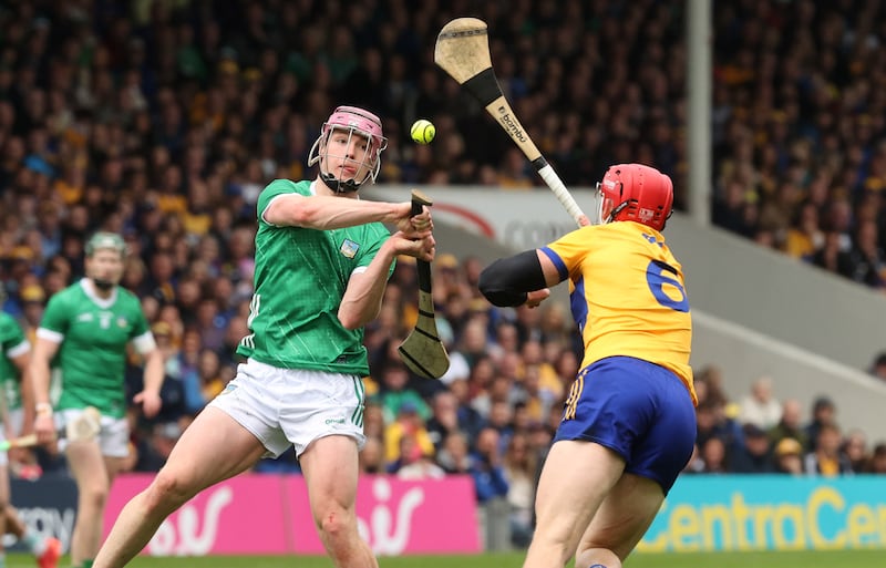 Limerick's Shane O'Brien and John Conlon of Clare during the 2024 Munster GAA Senior Hurling Championship final, FBD Semple Stadium, Thurles, Co Tipperary. Photograph: Bryan Keane/Inpho