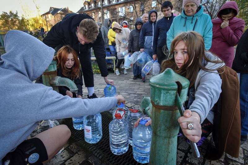 People take water from a water pump in Kyiv, Ukraine on Monday. Photograph: Oleg Petrasyuk/EPA 