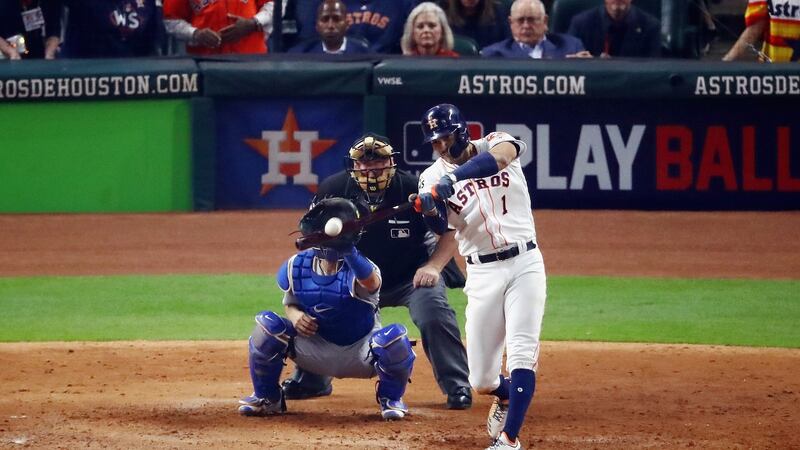 Carlos Correa of the Houston Astros hits a two-run home run during the seventh inning against the LA Dodgers. Photogaph: Ezra Shaw/Getty