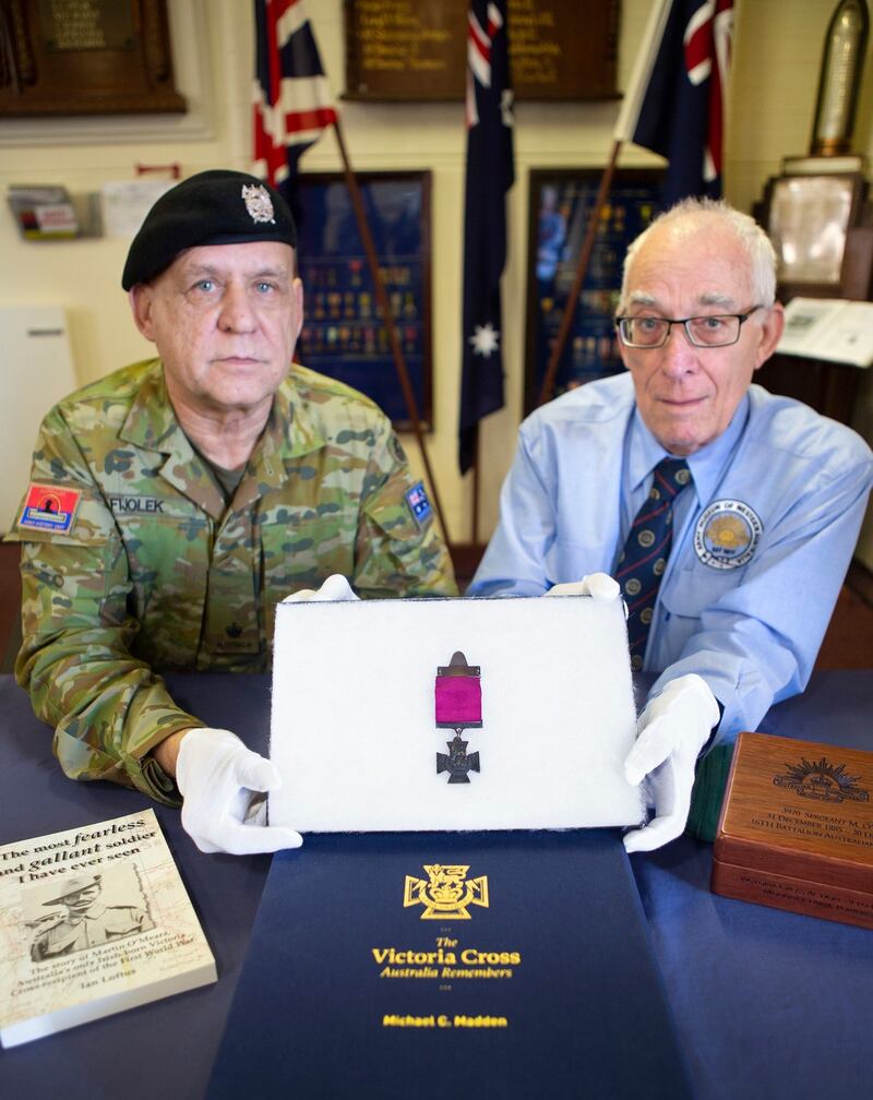 Major Henry Fijolek (left), manager of the Australian Army Museum of Western Australia in Fremantle, and deputy curator Richard Bennett holding a Victoria Cross medal awarded to Sergeant Martin O’Meara, an Irishman who served with the Australian army during the First World War. Photograph: Department of Defence, Australia/PA Wire