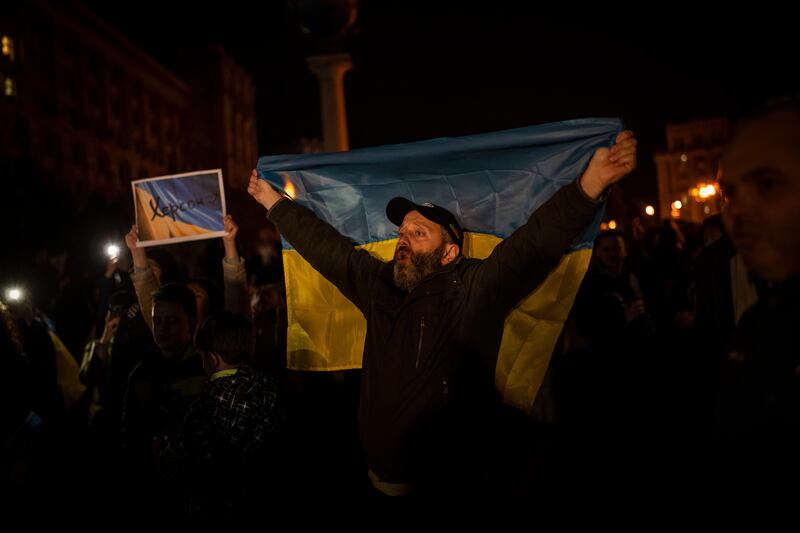 Ukrainians gather in central Kyiv to celebrate the recapturing of Kherson city. Photograph: Bernat Armangue/AP