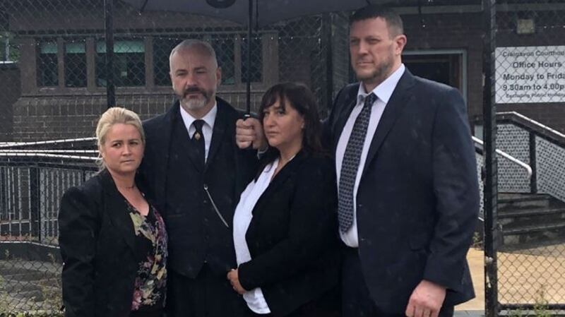 Outside the court, the defendants’  brother Mark Lauro (second from left) with his wife Bernadette Lauro (on left) and  his sister Diane Aston, here with her husband Neil Aston (right), read a prepared statement. Photograph: Paul Higgins