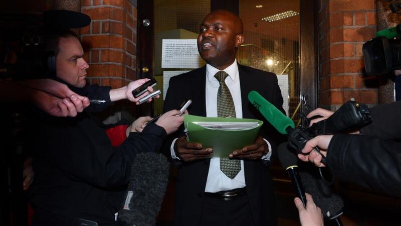 Solicitor Waheed Mudah reading a statement by a west Dublin Roma family last night whose daughter was reunited with them. Photograph: Cyril Byrne